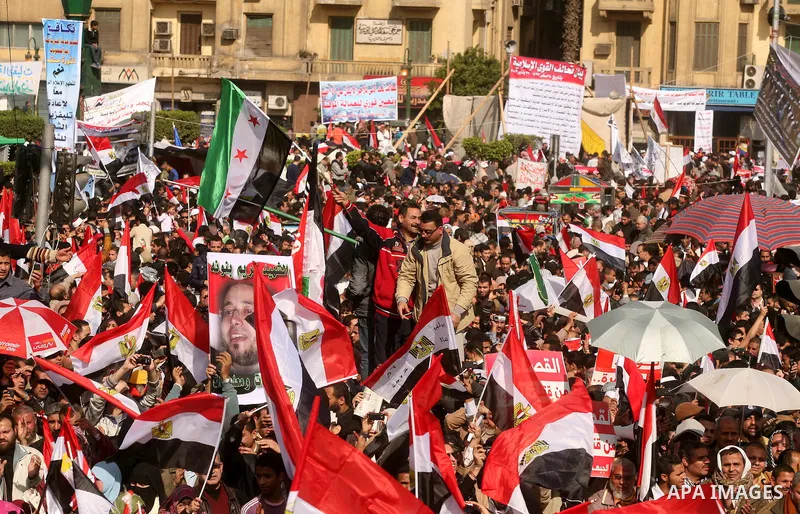 Egyptian demonstrators gather to celebrate the one year anniversary of the 25th January uprising at Tahrir square in Cairo, Egypt, 25 January 2012. One year earlier the same day Egyptians started an uprising which result...