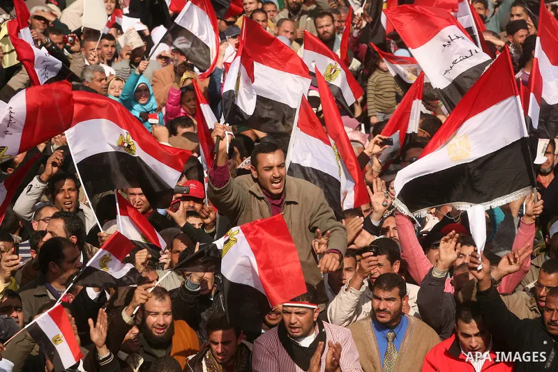 Egyptian demonstrators gather to celebrate the one year anniversary of the 25th January uprising at Tahrir square in Cairo, Egypt, 25 January 2012. One year earlier the same day Egyptians started an uprising which result...