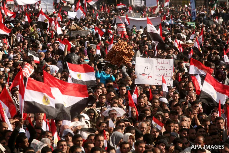 Egyptian demonstrators gather to celebrate the one year anniversary of the 25th January uprising at Tahrir square in Cairo, Egypt, 25 January 2012. One year earlier the same day Egyptians started an uprising which result...