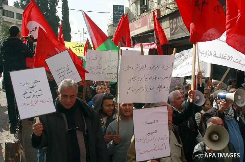 Palestinians protest against rising prices and taxes in the West Bank city of Tul Karem. Thursday, Jan. 26, 2012. Palestinian Authority Prime Minister Salam Fayyad has sparked a furor with a push to get Palestinians to p...
