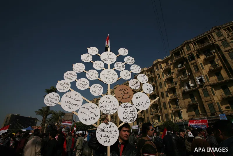 Egyptian demonstrators gather to celebrate the one year anniversary of the 25th January uprising at Tahrir square in Cairo, Egypt, 25 January 2012. One year earlier the same day Egyptians started an uprising which result...