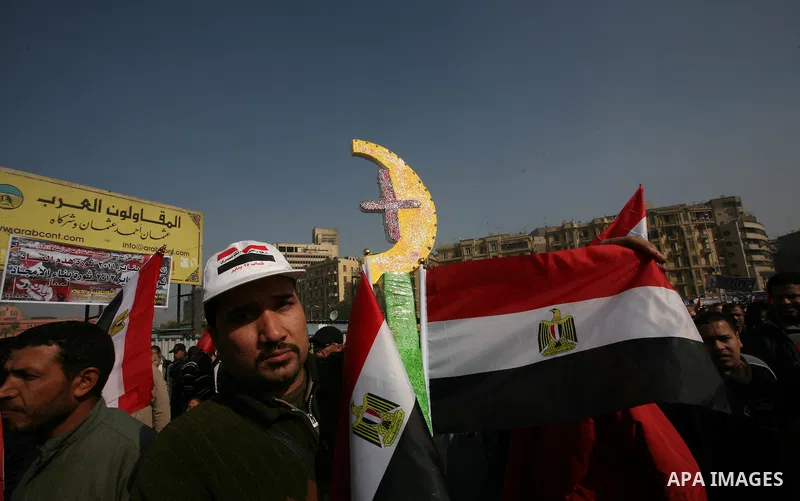 Egyptian demonstrators gather to celebrate the one year anniversary of the 25th January uprising at Tahrir square in Cairo, Egypt, 25 January 2012. One year earlier the same day Egyptians started an uprising which result...