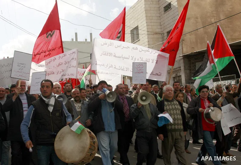 Palestinians protest against rising prices and taxes in the West Bank city of Tul Karem. Thursday, Jan. 26, 2012. Palestinian Authority Prime Minister Salam Fayyad has sparked a furor with a push to get Palestinians to p...