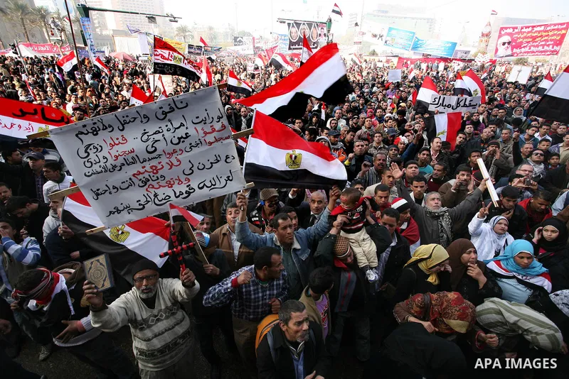 Egyptian demonstrators gather to celebrate the one year anniversary of the 25th January uprising at Tahrir square in Cairo, Egypt, 25 January 2012. One year earlier the same day Egyptians started an uprising which result...