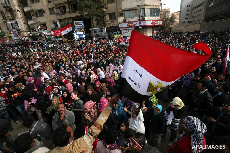 Demonstrators take part in a protest at Tahrir square in Cairo January 26, 2012. Scores of Egyptian youth protesters marking the one-year anniversary of the uprising that ousted Hosni Mubarak bedded down in Tahrir Square...