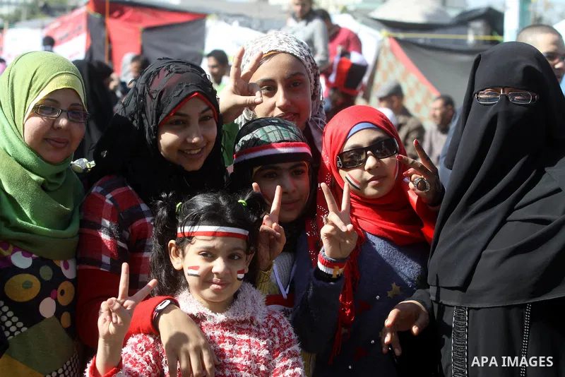Egyptian women gather during a protest demanding the army to hand power to civilians at Tahrir square in Cairo on January 27, 2012, a year after a popular uprising. The protesters are demanding the implementation of the...