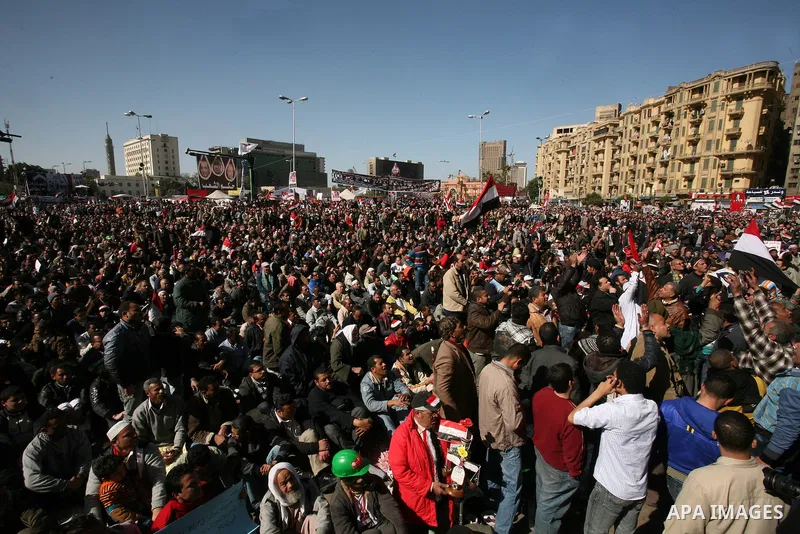 Egyptian demonstrators gather during a protest demanding the army to hand power to civilians at Tahrir square in Cairo on January 27, 2012, a year after a popular uprising. The protesters are demanding the implementation...