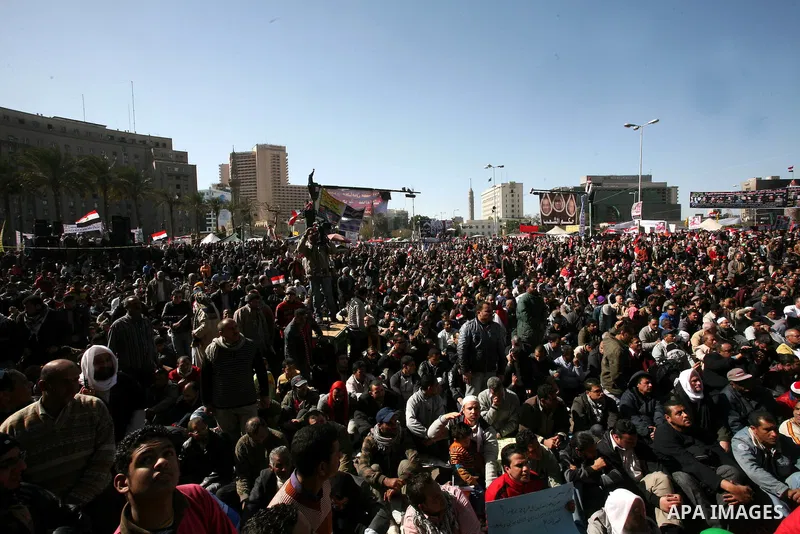 Egyptian demonstrators gather during a protest demanding the army to hand power to civilians at Tahrir square in Cairo on January 27, 2012, a year after a popular uprising. The protesters are demanding the implementation...