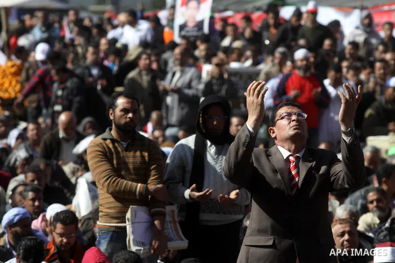 Egyptian demonstrators gather during a protest demanding the army to hand power to civilians at Tahrir square in Cairo on January 27, 2012, a year after a popular uprising. The protesters are demanding the implementation...