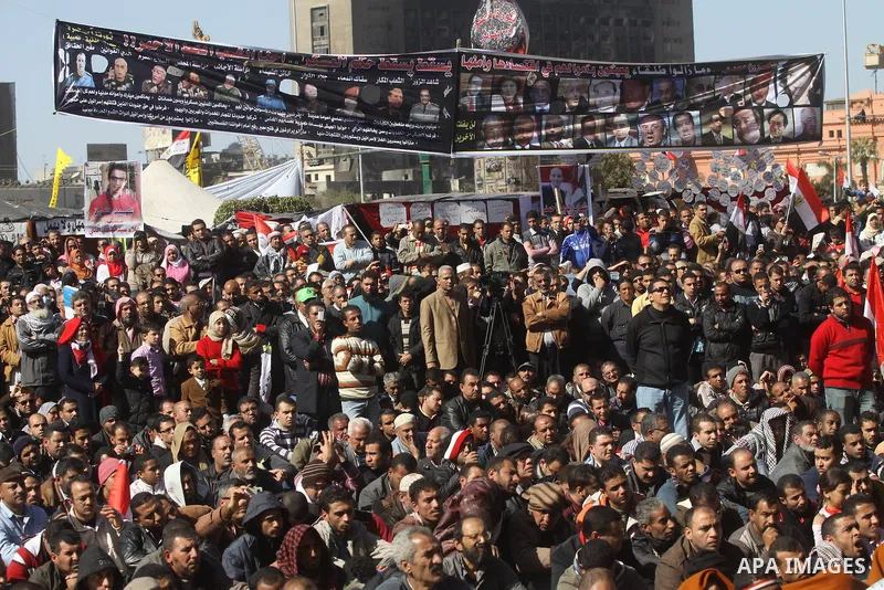 Egyptian demonstrators gather during a protest demanding the army to hand power to civilians at Tahrir square in Cairo on January 27, 2012, a year after a popular uprising. The protesters are demanding the implementation...