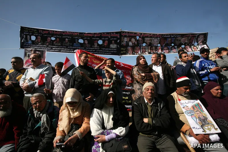 Egyptian demonstrators gather during a protest demanding the army to hand power to civilians at Tahrir square in Cairo on January 27, 2012, a year after a popular uprising. The protesters are demanding the implementation...
