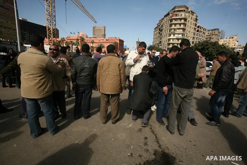 Egyptian demonstrators gather during a protest demanding the army to hand power to civilians at Tahrir square in Cairo on January 27, 2012, a year after a popular uprising. The protesters are demanding the implementation...