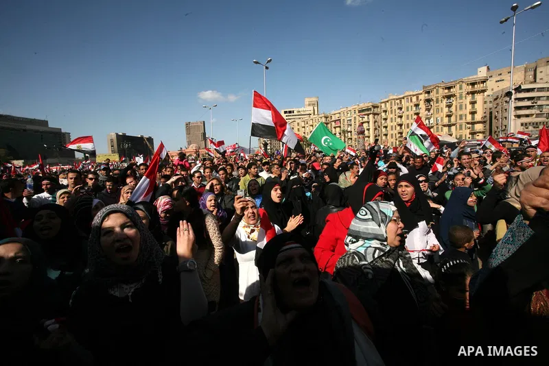 Egyptian demonstrators gather during a protest demanding the army to hand power to civilians at Tahrir square in Cairo on January 27, 2012, a year after a popular uprising. The protesters are demanding the implementation...