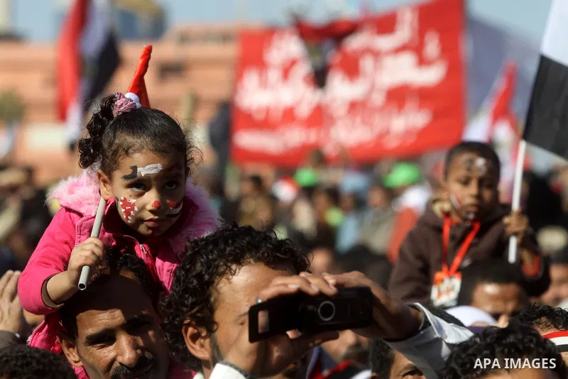 Egyptian demonstrators gather during a protest demanding the army to hand power to civilians at Tahrir square in Cairo on January 27, 2012, a year after a popular uprising. The protesters are demanding the implementation...