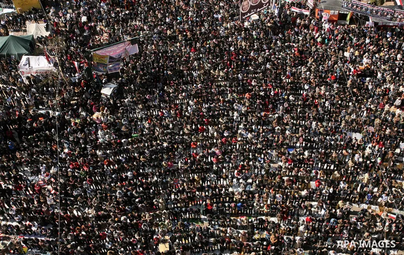 Egyptian demonstrators gather during a protest demanding the army to hand power to civilians at Tahrir square in Cairo on January 27, 2012, a year after a popular uprising. The protesters are demanding the implementation...
