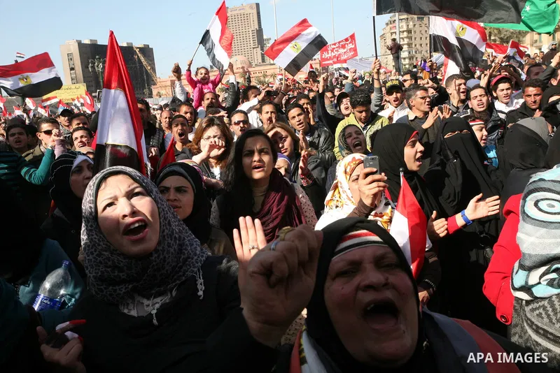 Egyptian demonstrators gather during a protest demanding the army to hand power to civilians at Tahrir square in Cairo on January 27, 2012, a year after a popular uprising. The protesters are demanding the implementation...