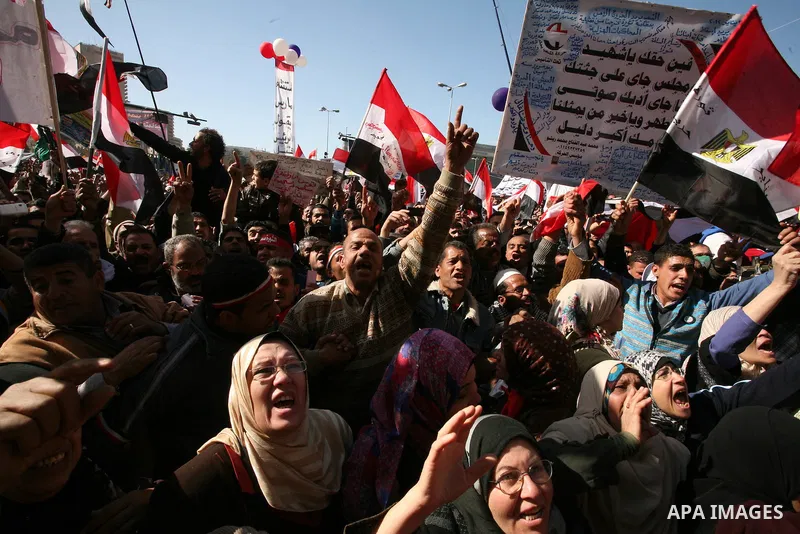 Egyptian demonstrators gather during a protest demanding the army to hand power to civilians at Tahrir square in Cairo on January 27, 2012, a year after a popular uprising. The protesters are demanding the implementation...