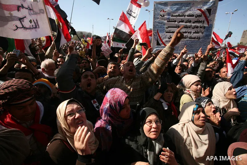 Egyptian demonstrators gather during a protest demanding the army to hand power to civilians at Tahrir square in Cairo on January 27, 2012, a year after a popular uprising. The protesters are demanding the implementation...