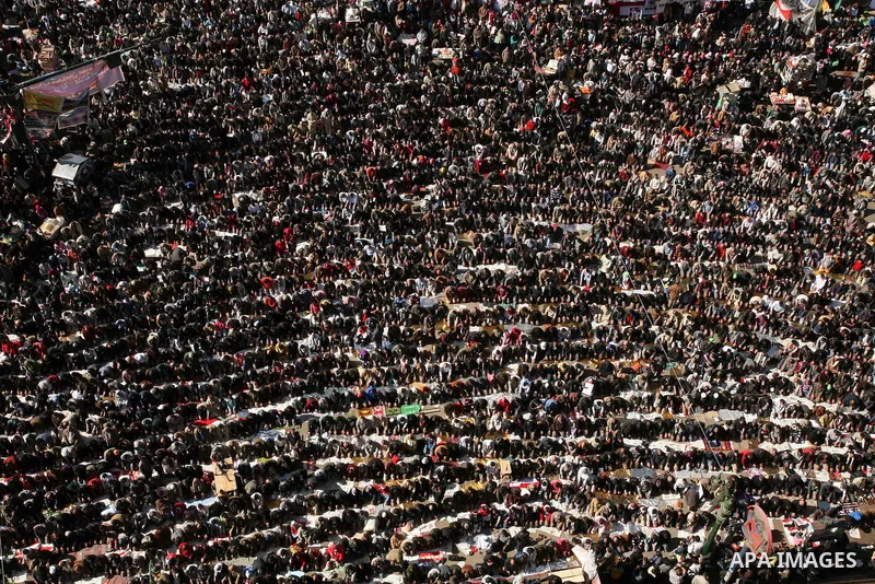 Egyptian demonstrators gather during a protest demanding the army to hand power to civilians at Tahrir square in Cairo on January 27, 2012, a year after a popular uprising. The protesters are demanding the implementation...