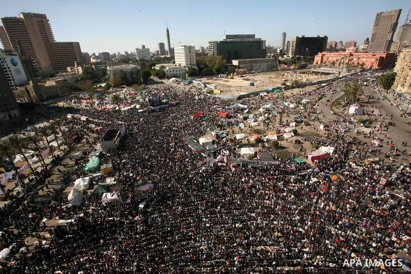 Egyptian demonstrators gather during a protest demanding the army to hand power to civilians at Tahrir square in Cairo on January 27, 2012, a year after a popular uprising. The protesters are demanding the implementation...