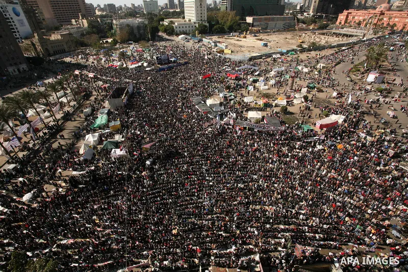 Egyptian demonstrators gather during a protest demanding the army to hand power to civilians at Tahrir square in Cairo on January 27, 2012, a year after a popular uprising. The protesters are demanding the implementation...