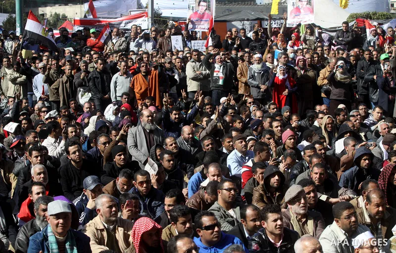 Egyptian demonstrators gather during a protest demanding the army to hand power to civilians at Tahrir square in Cairo on January 27, 2012, a year after a popular uprising. The protesters are demanding the implementation...