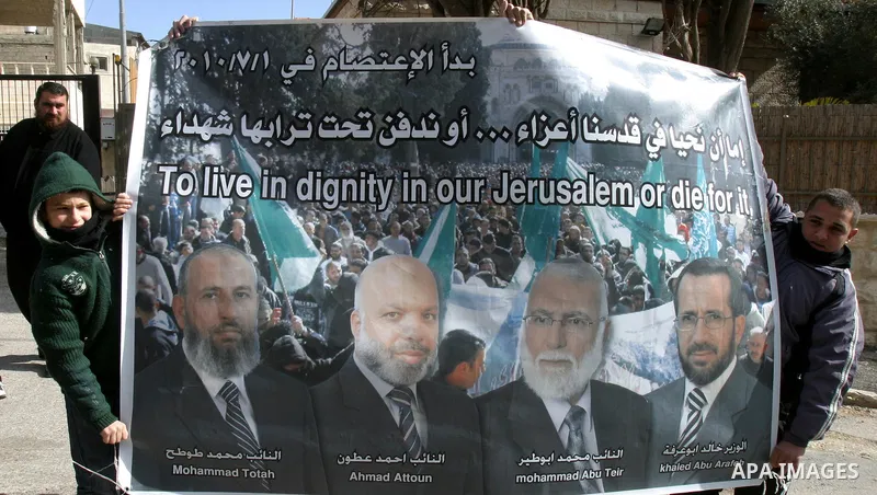 .Palestinians attend Friday prayers outside the Red Cross offices during a protest in east Jerusalem on January 27, 2012 in support with four senior Hamas officials whom Israel has been seeking to expel, sparking concern...