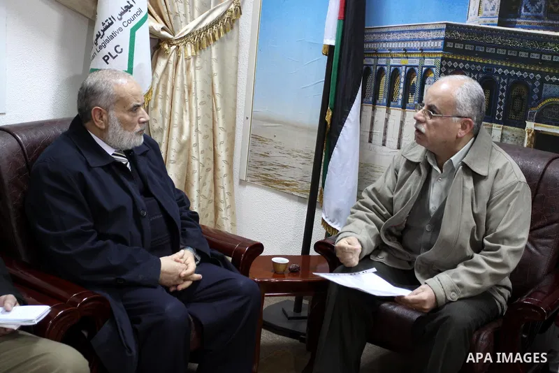The spokesman of the Palestinian parliament, Ahmed Bahr, listens to complaints the palestinian Citizens', in Gaza City, on Jan 28. 2012. Photo by Mohammed Asad
