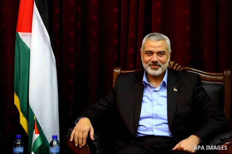 Palestinian Prime Minister in Gaza Strip, Ismail Haniya Meet with the head of Central Elections Committee, Hanna Nasser, in Gaza city, on Jan. 29, 2012. Photo by Ashraf Amra