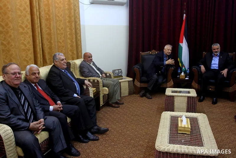 Palestinian Prime Minister in Gaza Strip, Ismail Haniya Meet with the head of Central Elections Committee, Hanna Nasser, in Gaza city, on Jan. 29, 2012. Photo by Ashraf Amra
