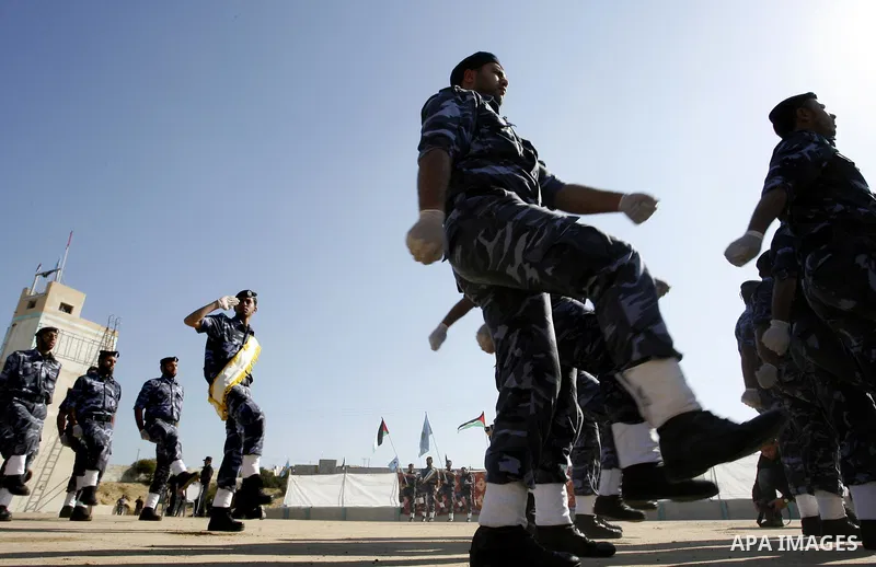 Hamas police officers march in formation during a graduation ceremony from a military course in the southern Gaza Strip city of Khan Yunis on January 29, 2012. Photo by Abed Rahim Khatib