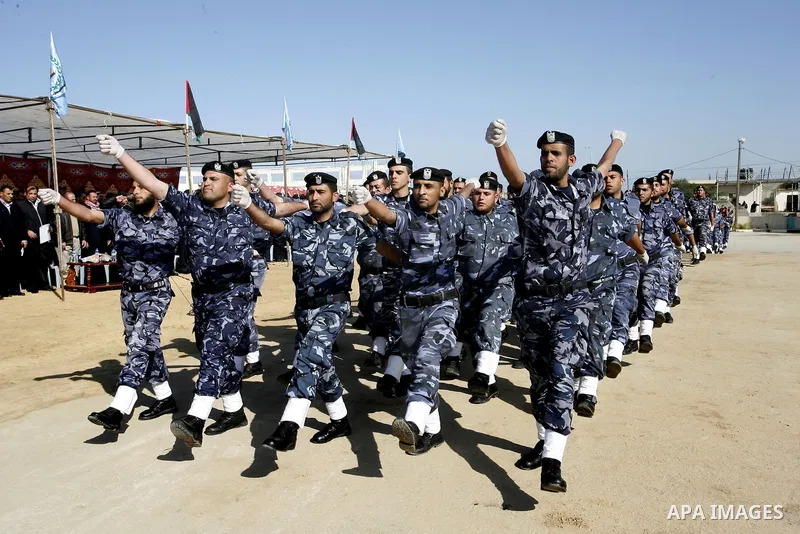 Hamas police officers march in formation during a graduation ceremony from a military course in the southern Gaza Strip city of Khan Yunis on January 29, 2012. Photo by Abed Rahim Khatib