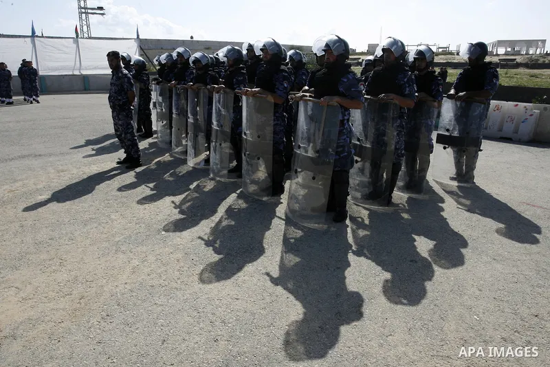 Hamas police officers march in formation during a graduation ceremony from a military course in the southern Gaza Strip city of Khan Yunis on January 29, 2012. Photo by Abed Rahim Khatib