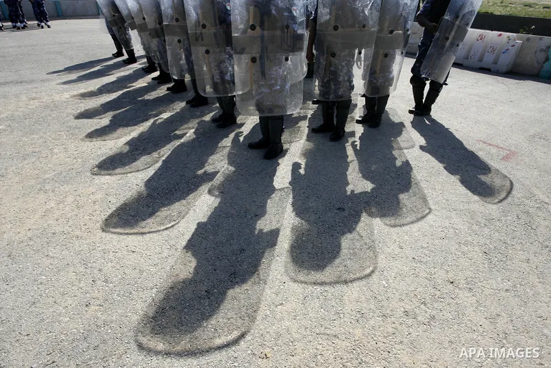 Hamas police officers march in formation during a graduation ceremony from a military course in the southern Gaza Strip city of Khan Yunis on January 29, 2012. Photo by Abed Rahim Khatib