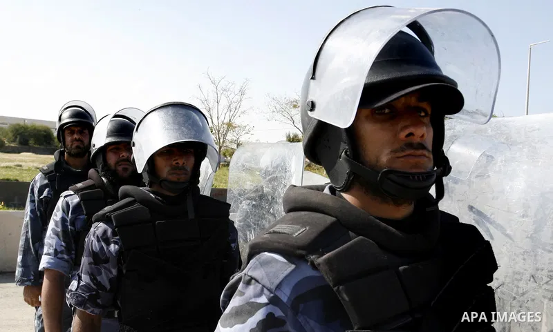 Hamas police officers march in formation during a graduation ceremony from a military course in the southern Gaza Strip city of Khan Yunis on January 29, 2012. Photo by Abed Rahim Khatib