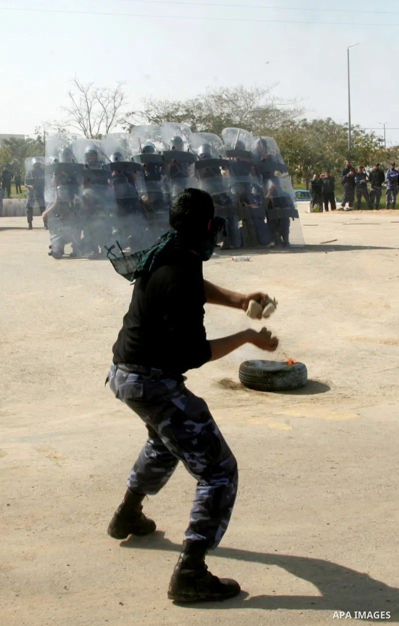 Hamas police officers display their skills during a graduation ceremony from a military course in the southern Gaza Strip city of Khan Yunis on January 29, 2012. Photo by Abed Rahim Khatib