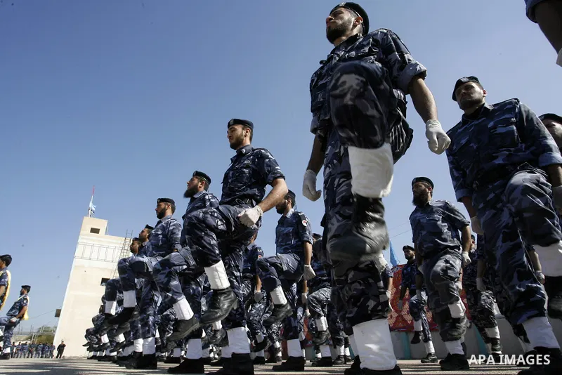 Hamas police officers march in formation during a graduation ceremony from a military course in the southern Gaza Strip city of Khan Yunis on January 29, 2012. Photo by Abed Rahim Khatib