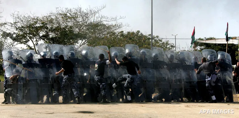 Hamas police officers march in formation during a graduation ceremony from a military course in the southern Gaza Strip city of Khan Yunis on January 29, 2012. Photo by Abed Rahim Khatib