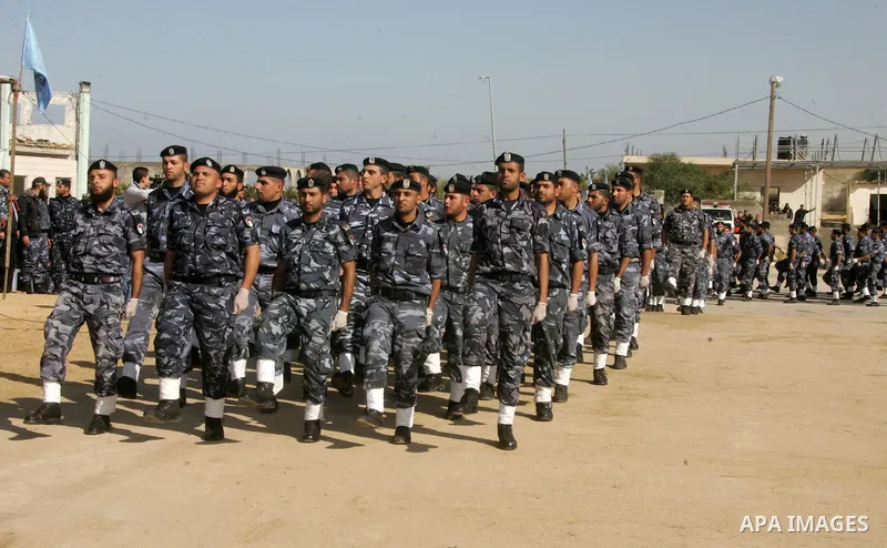 Hamas police officers march in formation during a graduation ceremony from a military course in the southern Gaza Strip city of Khan Yunis on January 29, 2012. Photo by Abed Rahim Khatib