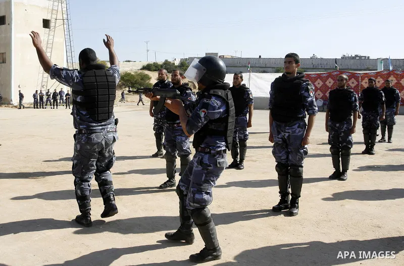 Hamas police officers display their skills during a graduation ceremony from a military course in the southern Gaza Strip city of Khan Yunis on January 29, 2012. Photo by Abed Rahim Khatib
