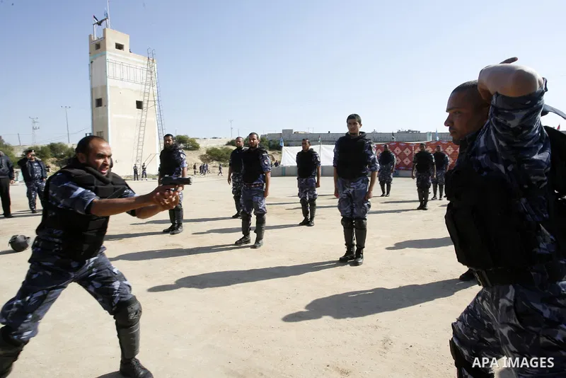 Hamas police officers display their skills during a graduation ceremony from a military course in the southern Gaza Strip city of Khan Yunis on January 29, 2012. Photo by Abed Rahim Khatib