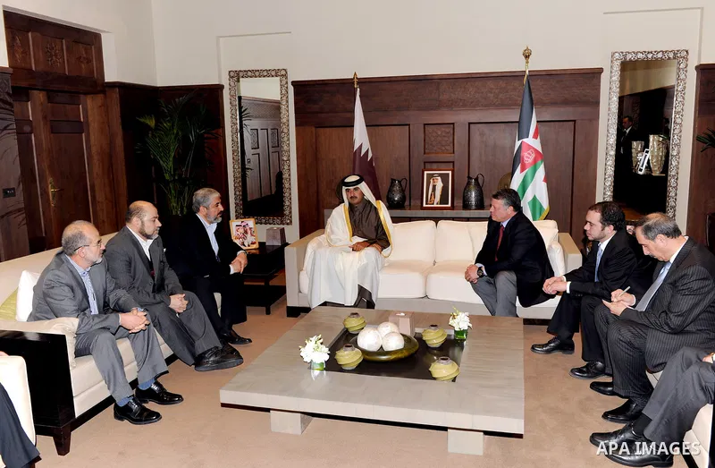 Crown Prince of Qatar Sheikh Tamim bin Hamad, center, speaks to Hamas leader Khaled Mashaal, left, and King Abdullah II of Jordan, right, in Amman, Jordan, Sunday, Jan. Jan. 29, 2012.A high-profile visit to Jordan by the...