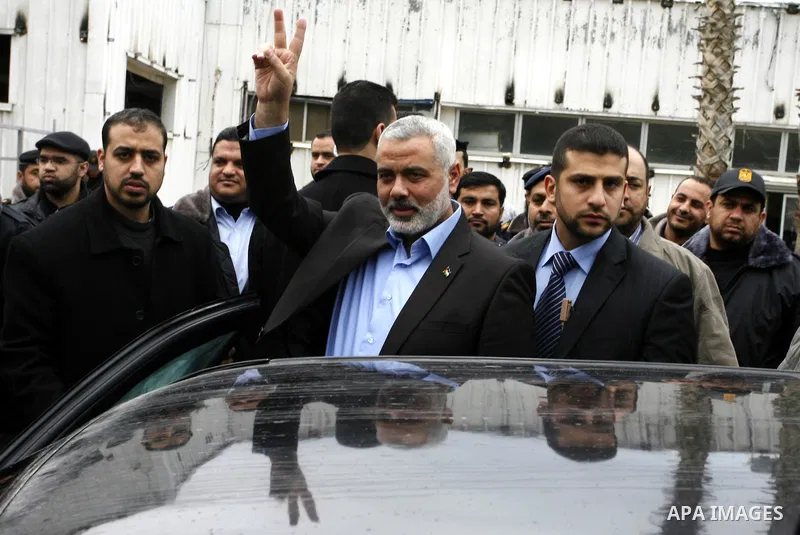 Palestinian Prime Minister in Gaza Strip, Ismail Haniya, arrived to the Rafah border crossing in the southern Gaza Strip on Jan. 30, 2012. as he leaves on a regional tour expected to include stops in Iran, Qatar and Bahr...