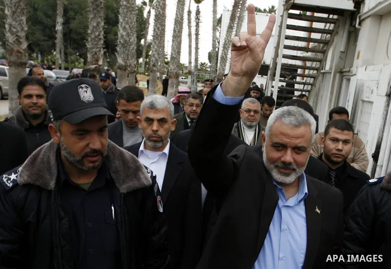 Palestinian Prime Minister in Gaza Strip, Ismail Haniya, arrived to the Rafah border crossing in the southern Gaza Strip on Jan. 30, 2012. as he leaves on a regional tour expected to include stops in Iran, Qatar and Bahr...