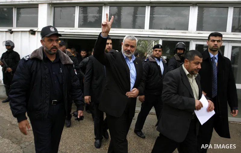 Palestinian Prime Minister in Gaza Strip, Ismail Haniya, arrived to the Rafah border crossing in the southern Gaza Strip on Jan. 30, 2012. as he leaves on a regional tour expected to include stops in Iran, Qatar and Bahr...