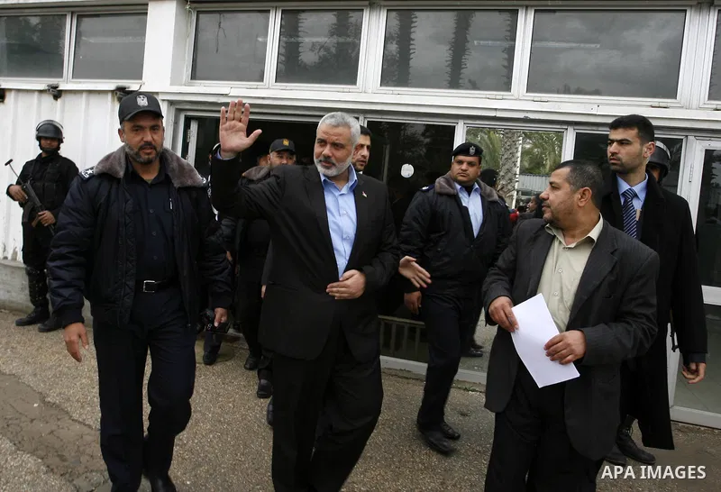 Palestinian Prime Minister in Gaza Strip, Ismail Haniya, arrived to the Rafah border crossing in the southern Gaza Strip on Jan. 30, 2012. as he leaves on a regional tour expected to include stops in Iran, Qatar and Bahr...