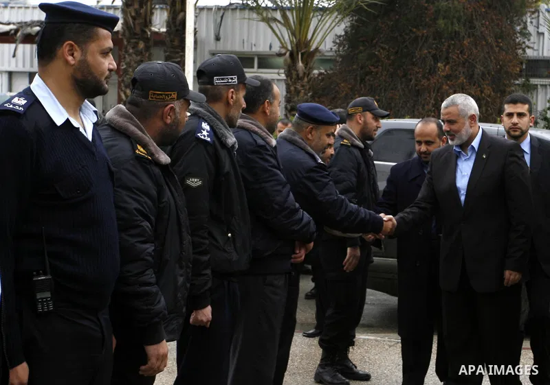 Palestinian Prime Minister in Gaza Strip, Ismail Haniya, arrived to the Rafah border crossing in the southern Gaza Strip on Jan. 30, 2012. as he leaves on a regional tour expected to include stops in Iran, Qatar and Bahr...