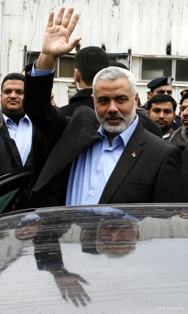 Palestinian Prime Minister in Gaza Strip, Ismail Haniya, arrived to the Rafah border crossing in the southern Gaza Strip on Jan. 30, 2012. as he leaves on a regional tour expected to include stops in Iran, Qatar and Bahr...