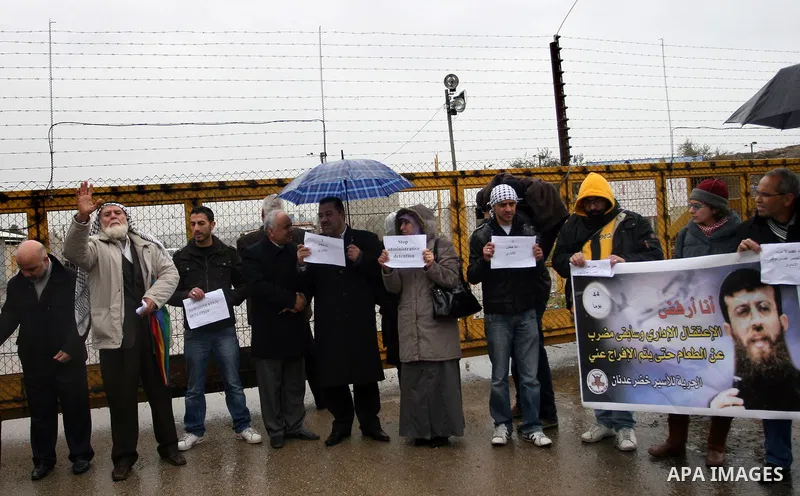 A Palestinian demonstrator shouts slogans during a protest in support of jailed Islamic Jihad spokesman Khodr Adnan outside Israel's Ofer prison near the West Bank town of Betunia on January 30, 2012. Adnan has been on h...