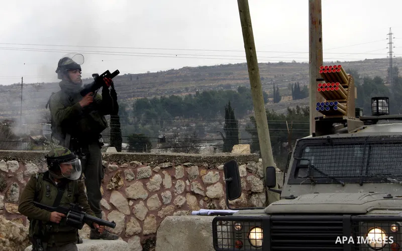 Protesters clash with Israeli soldiers during a demonstration by Palestinian and foreign activists who tried to reach Route 60, the main Jewish settler road in the West Bank, to protest against Israeli curbs on Palestini...